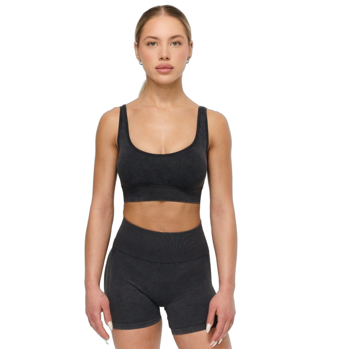 Reggiseno sportivo da donna in antracite, vista frontale. Spalline larghe e fascia inferiore a coste.