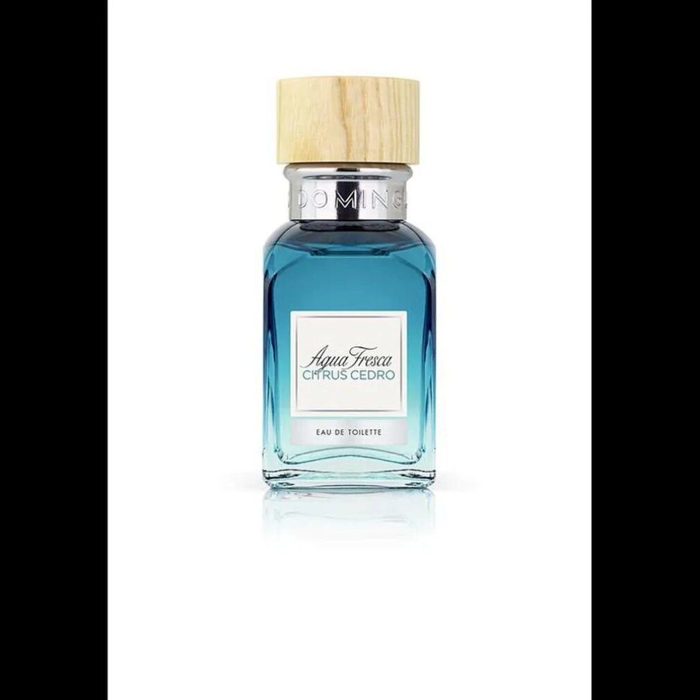 Flacone di profumo blu con tappo in legno. Scritta: Agua Fresca Citrus Cedro. Eau de Toilette.