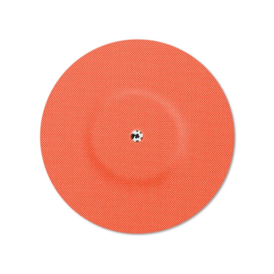 Cerotto rotondo arancione con foro di ventilazione al centro. Fine struttura diagonale sulla superficie.