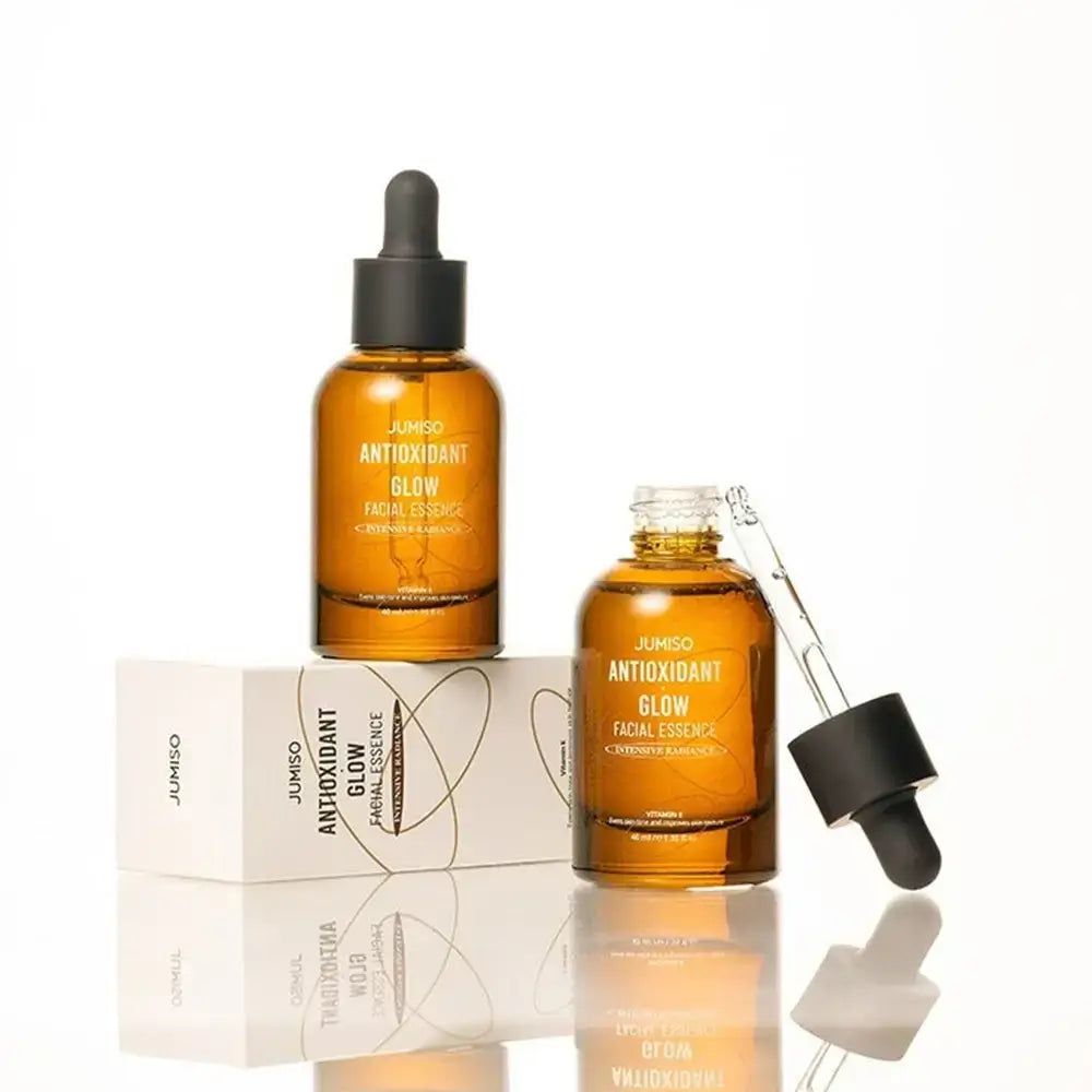 Due flaconi di JUMISO Antioxidant Glow Facial Essence, uno aperto, con contagocce.