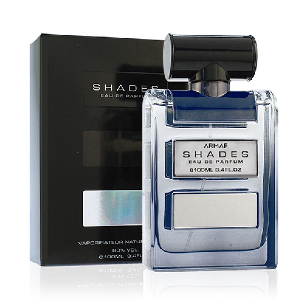 Scatola nera e flacone. Flacone con tre rettangoli. Testo: ARMAF SHADES Eau de Parfum. 100ml 3.4FL OZ.