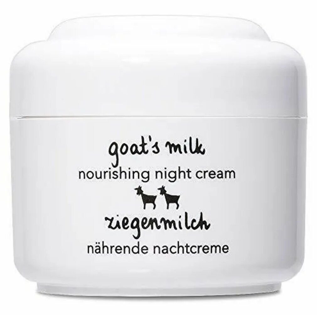 Vasetto bianco con scritta "goat's milk nourishing night cream" e Ziegenmilch. Illustrazioni di capre nere. Testo tedesco.