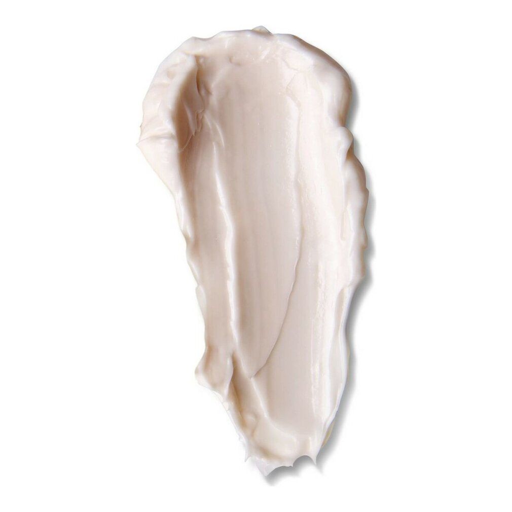 Strato di crema su sfondo bianco. Consistenza: liscia, beige chiaro. Forma: allungata, irregolare.