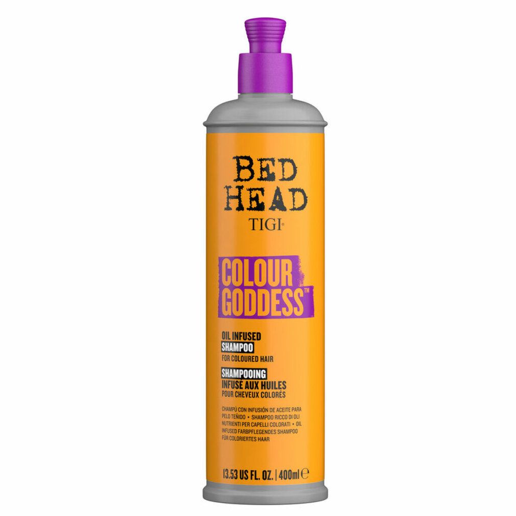 Flacone cilindrico con pompa viola. Scritta: Bed Head Tigi Colour Goddess Shampoo. Sfondo arancione.