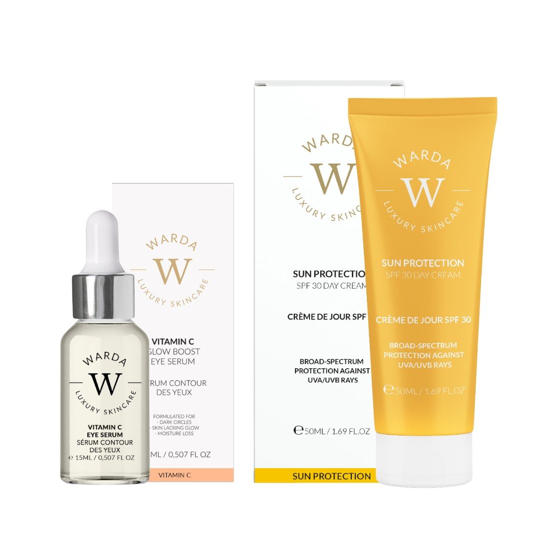 Flacone di siero e tubo di crema con confezione. Scritta: Vitamina C, SPF 30. Marchio: Warda Luxury Skincare.