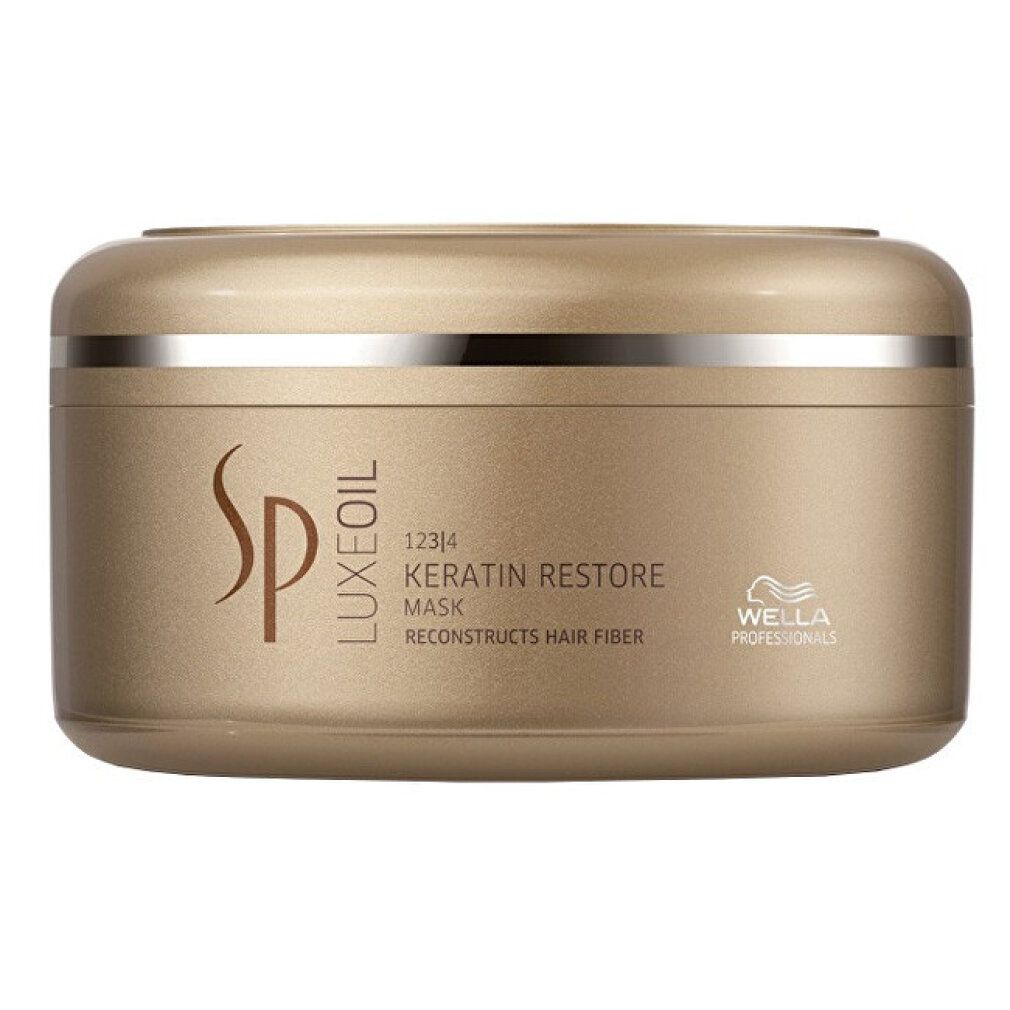 Vaso dorato con anello argentato. Scritta: SP Luxe Oil Keratin Restore Mask. Logo Wella Professionals.