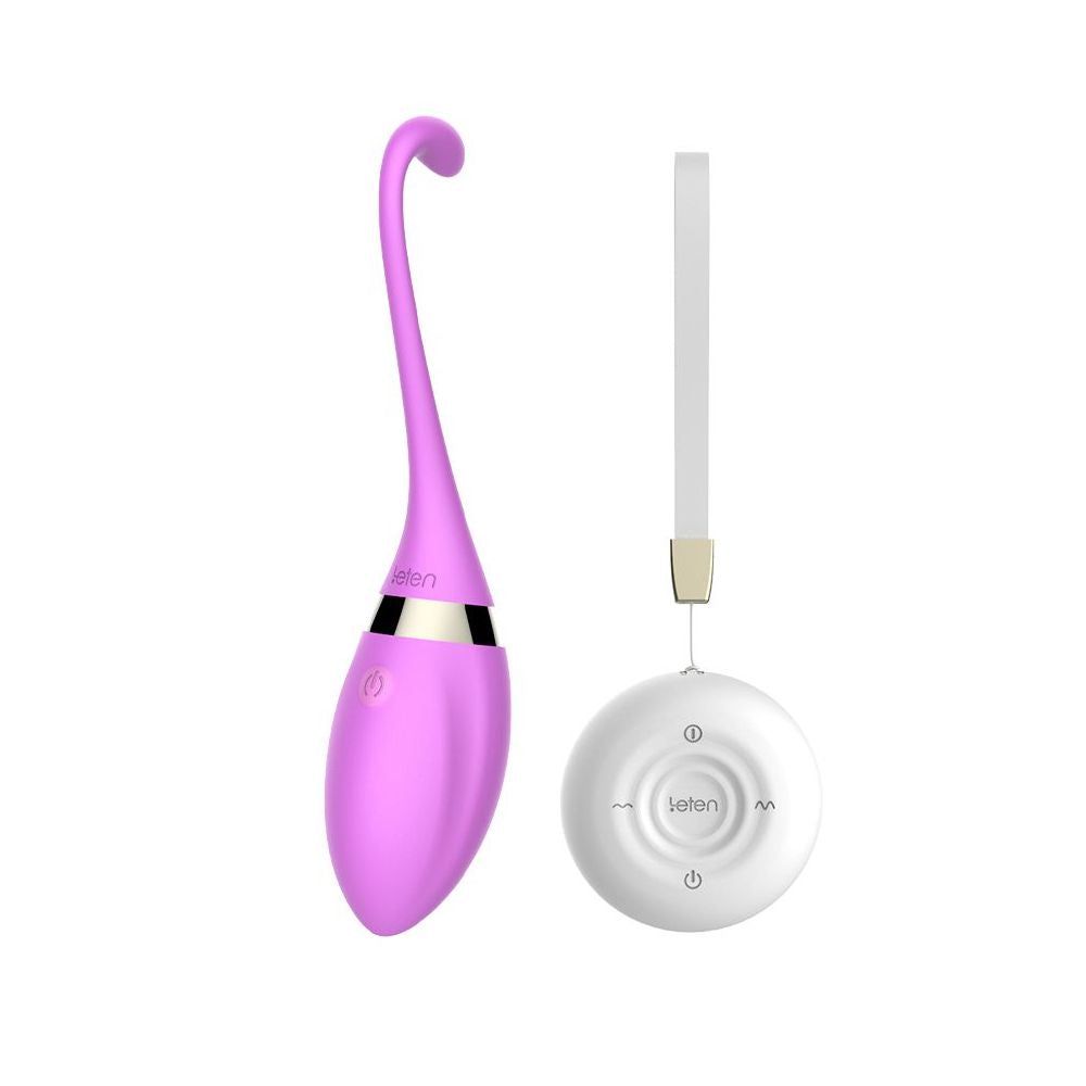 Vibratore viola con telecomando bianco. Il vibratore ha una forma curva e una base arrotondata. Il telecomando è bianco.