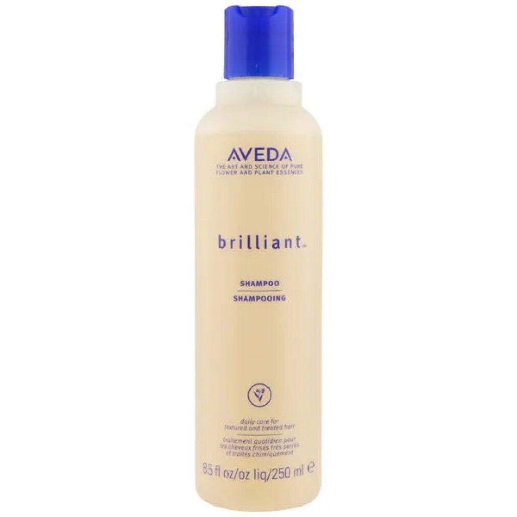 Flacone di shampoo Aveda Brilliant. Flacone beige con tappo blu. Testo: Aveda, brilliant, Shampooing. 250 ml.