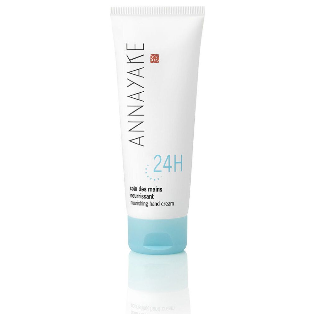 Tubo bianco con tappo blu. Scritta: ANNAYAKE, 24H, soin des mains nourrissant, nourishing hand cream.