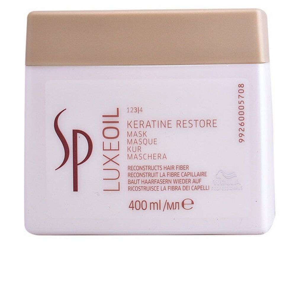 Vaso bianco con coperchio dorato. Scritta: SP Luxeoil Keratin Restore Mask. 400 ml.