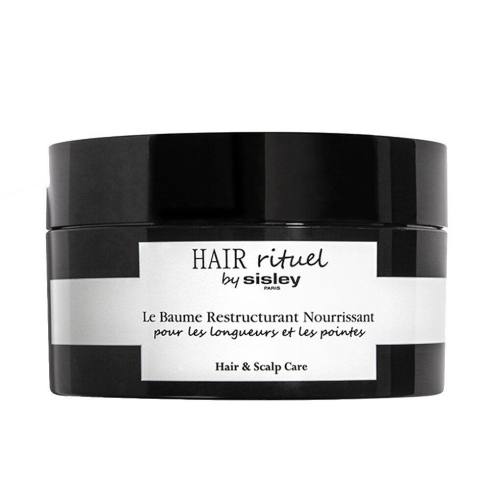 Vaso nero con etichetta bianca. Scritta: HAIR rituel by sisley PARIS. Le Baume Restructurant Nourrissant pour les longueurs et les pointes. Hair & Scalp Care.