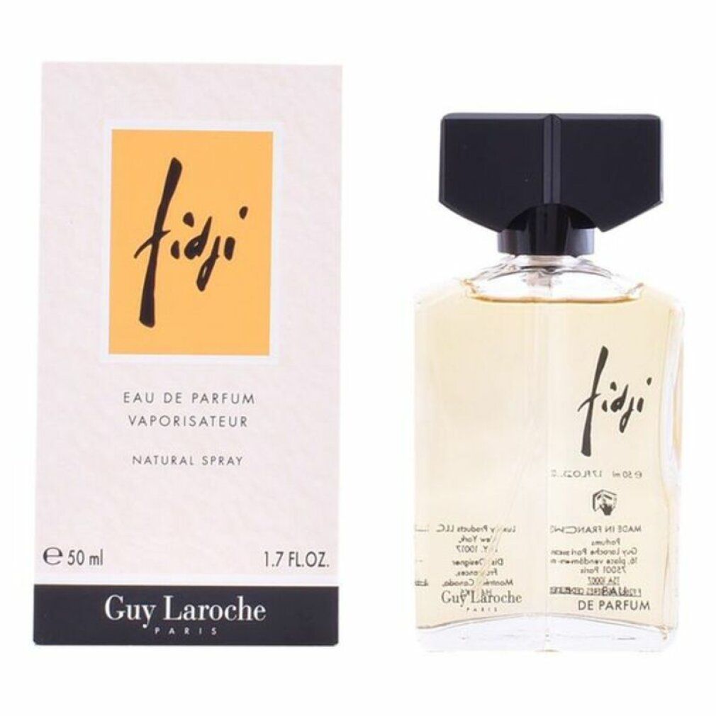 Flacone e confezione Fidji Eau de Parfum. Liquido giallo in flacone di vetro con tappo nero. Confezione con campo giallo e scritta.