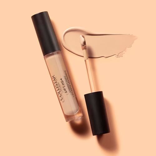 Correttore liquido beige con tappo nero e applicatore. Accanto, una macchia di correttore.