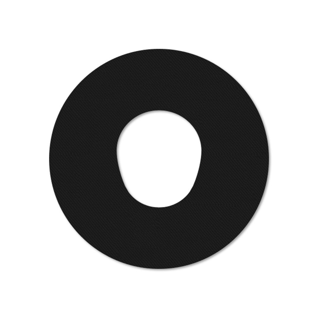 Cerotto di fissaggio nero con foro centrale. Forma rotonda, superficie strutturata.