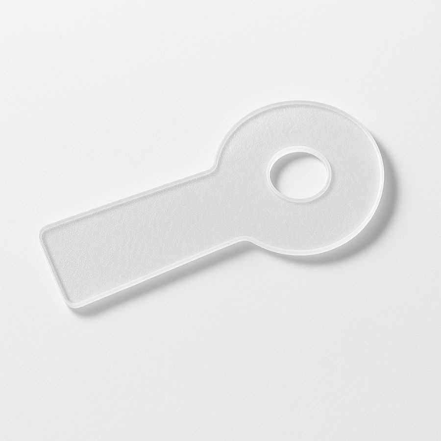 Cerotto in silicone bianco, forma ovale con manico. Foro centrale. Sfondo bianco.