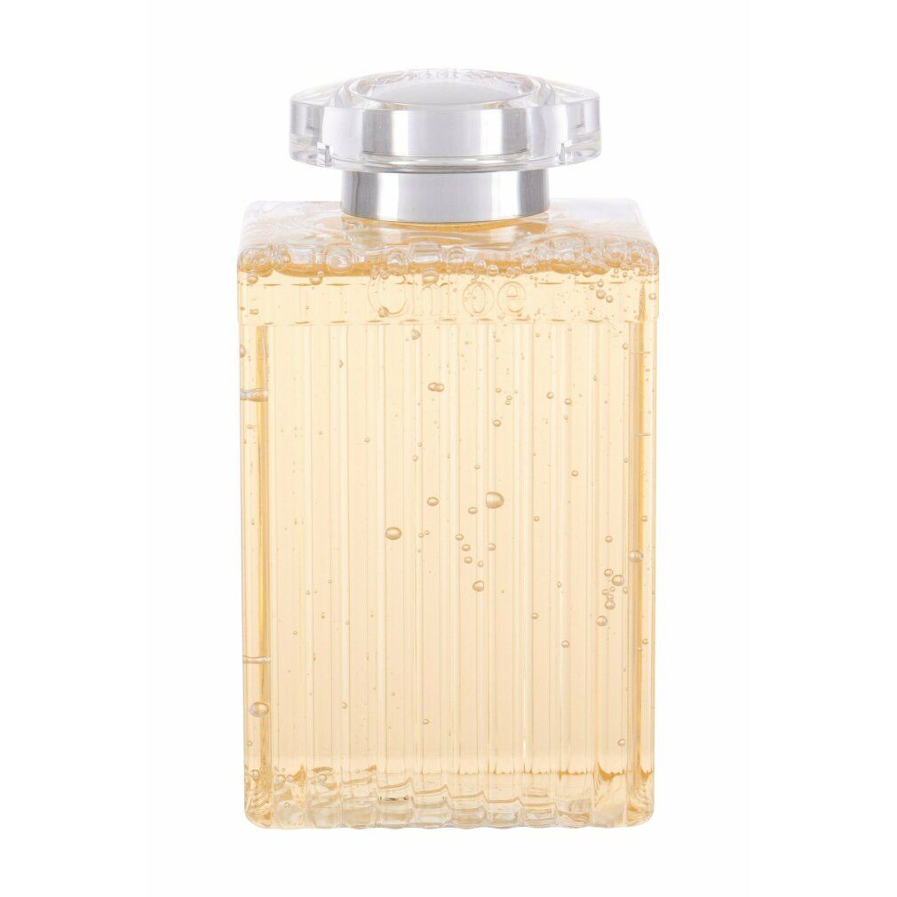 Flacone di gel doccia con liquido e bolle. Superficie scanalata, tappo argentato.