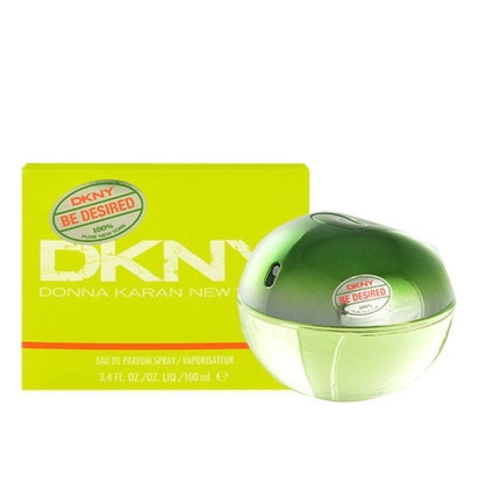 Flacone di profumo e confezione. Flacone rotondo, verde-giallo. Confezione rettangolare, gialla con scritta DKNY Be Desired.
