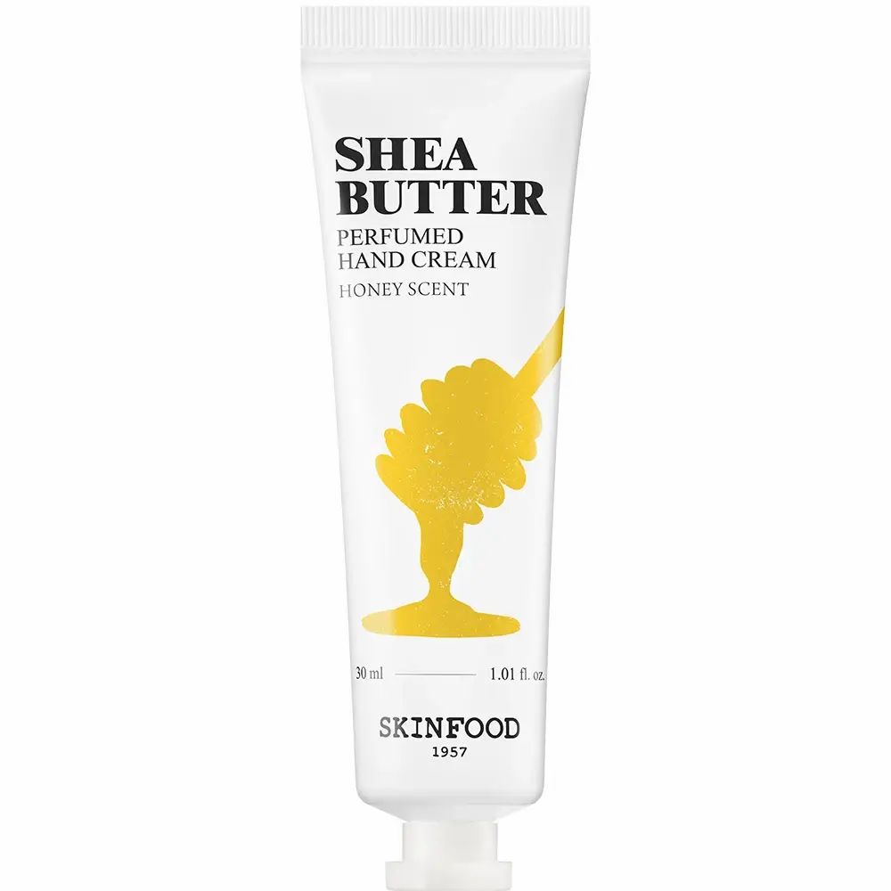 Tubo bianco di crema mani SKINFOOD Shea Butter. Scritta: Shea Butter, Honey Scent. Design a nido d'ape giallo.