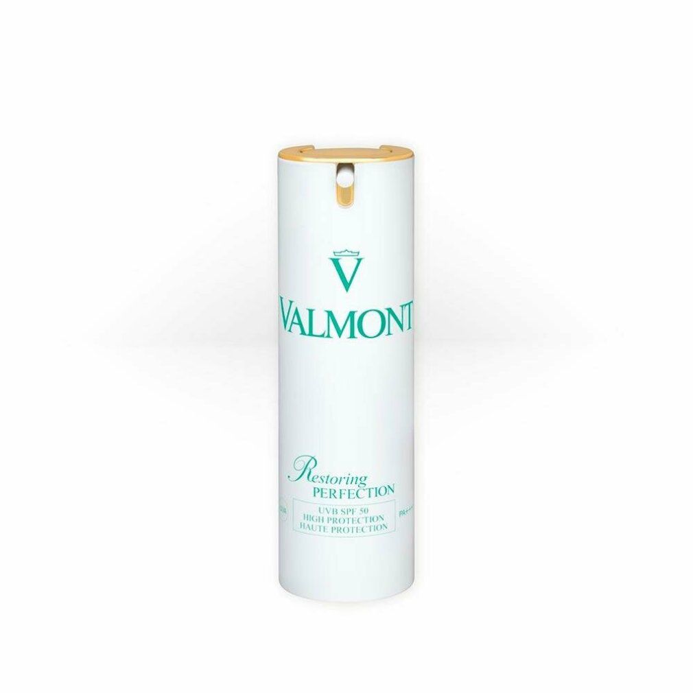 Cilindro bianco con chiusura dorata. Scritta verde: VALMONT, Restoring Perfection, SPF 50.