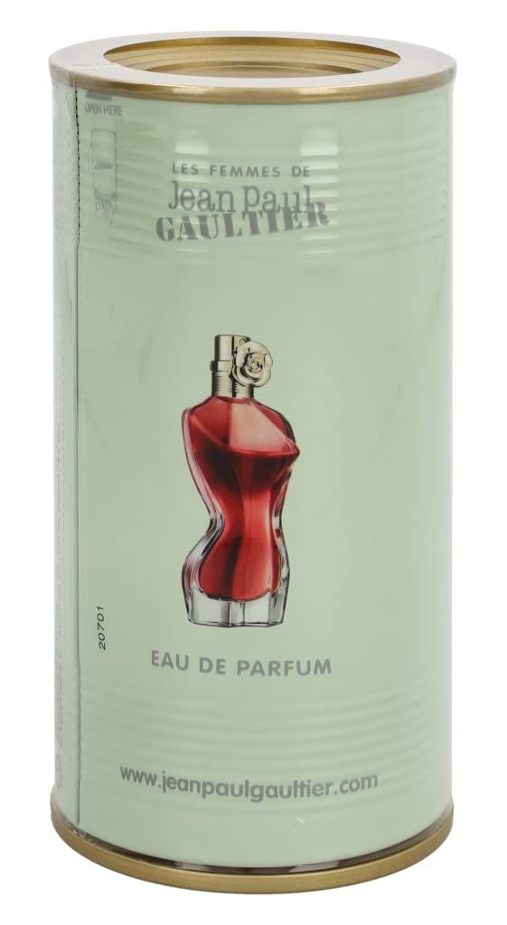 Scatola verde con immagine del flacone. Scritta: Eau de Parfum. Indirizzo del sito web. Flacone a forma di corpo femminile.