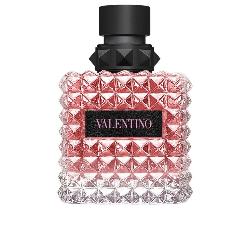 Flacone di profumo con liquido rosa. Tappo nero borchiato. Scritta VALENTINO.
