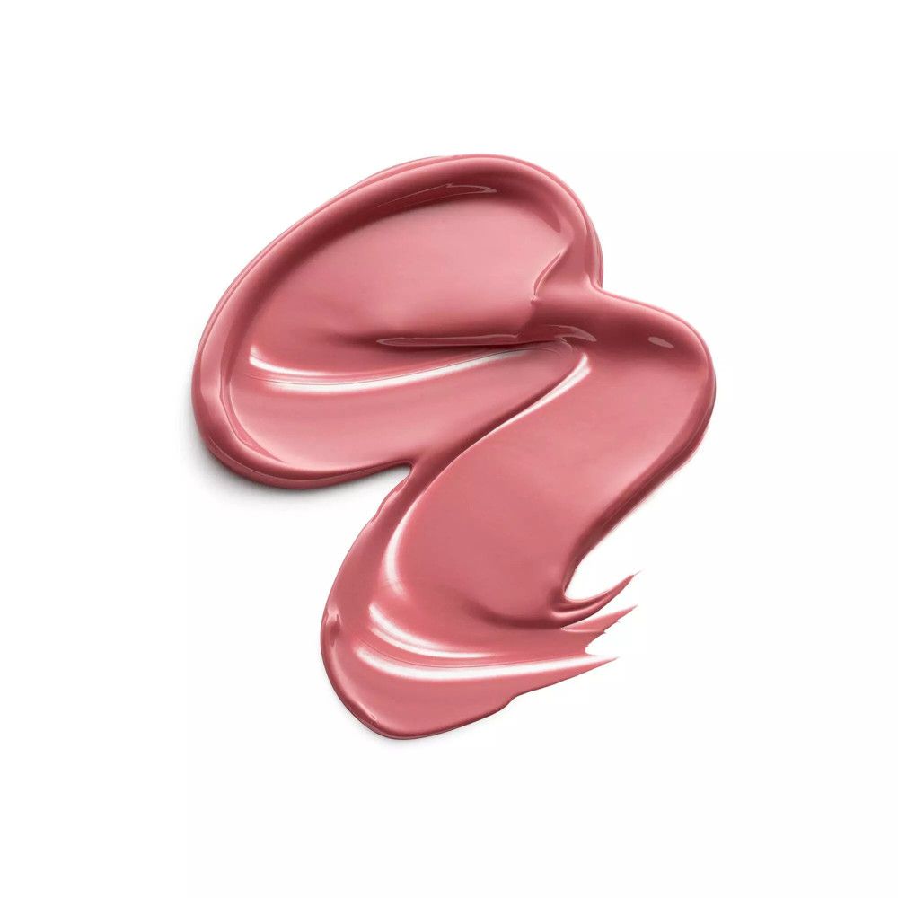 Swirl di rossetto rosa su sfondo bianco. Texture lucida.