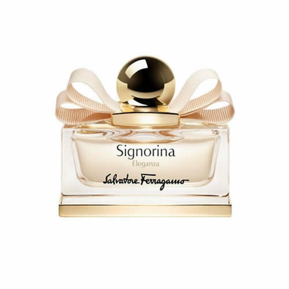 Flacone di profumo con tappo e fiocco dorati. Scritta Signorina Eleganza e Salvatore Ferragamo.
