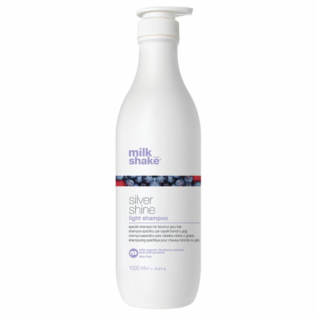 Flacone di shampoo bianco con dosatore. Scritta: milk_shake, Silver Shine light shampoo. 1000 ml.