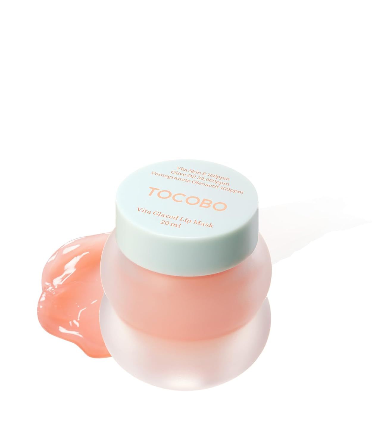 Vasetto rotondo con coperchio, nome del prodotto e marchio. Maschera labbra rosa. Testo: « TOCOBO Vita Glazed Lip Mask ».