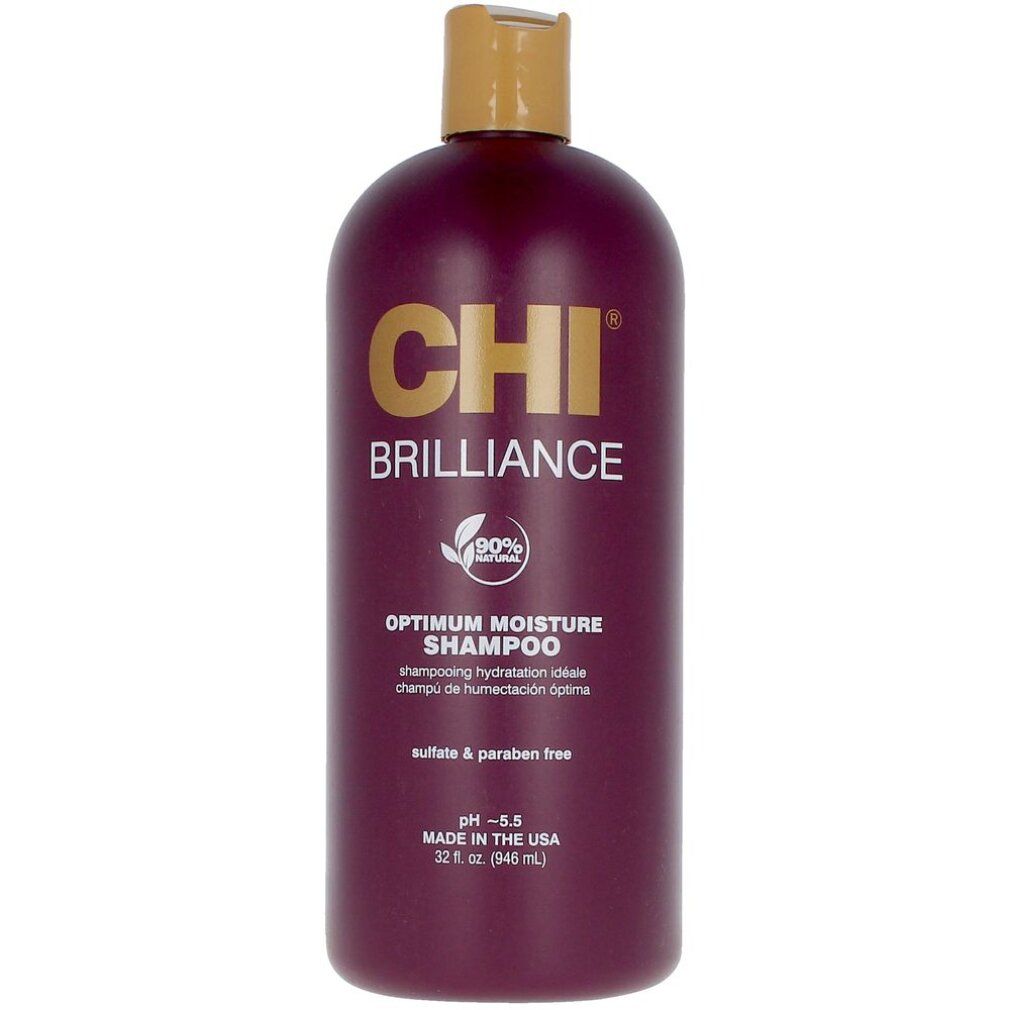 Flacone di shampoo bordeaux con tappo dorato. Scritta: CHI BRILLIANCE OPTIMUM MOISTURE SHAMPOO. 90% Natural. pH 5.5.