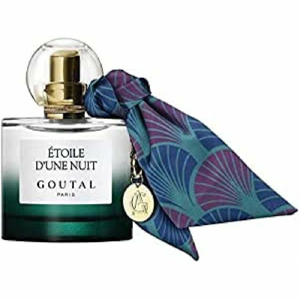 Flacone di profumo sfumato verde, tappo dorato e ciondolo. Sciarpa con motivo blu e viola attaccata al flacone.