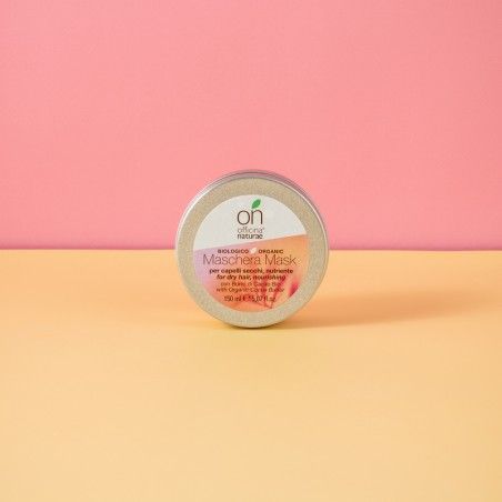 Barattolo rotondo con coperchio. Scritta: Officina Naturae, Maschera Mask, per capelli secchi. Contenuto: 150 ml. Sfondo: rosa e giallo.