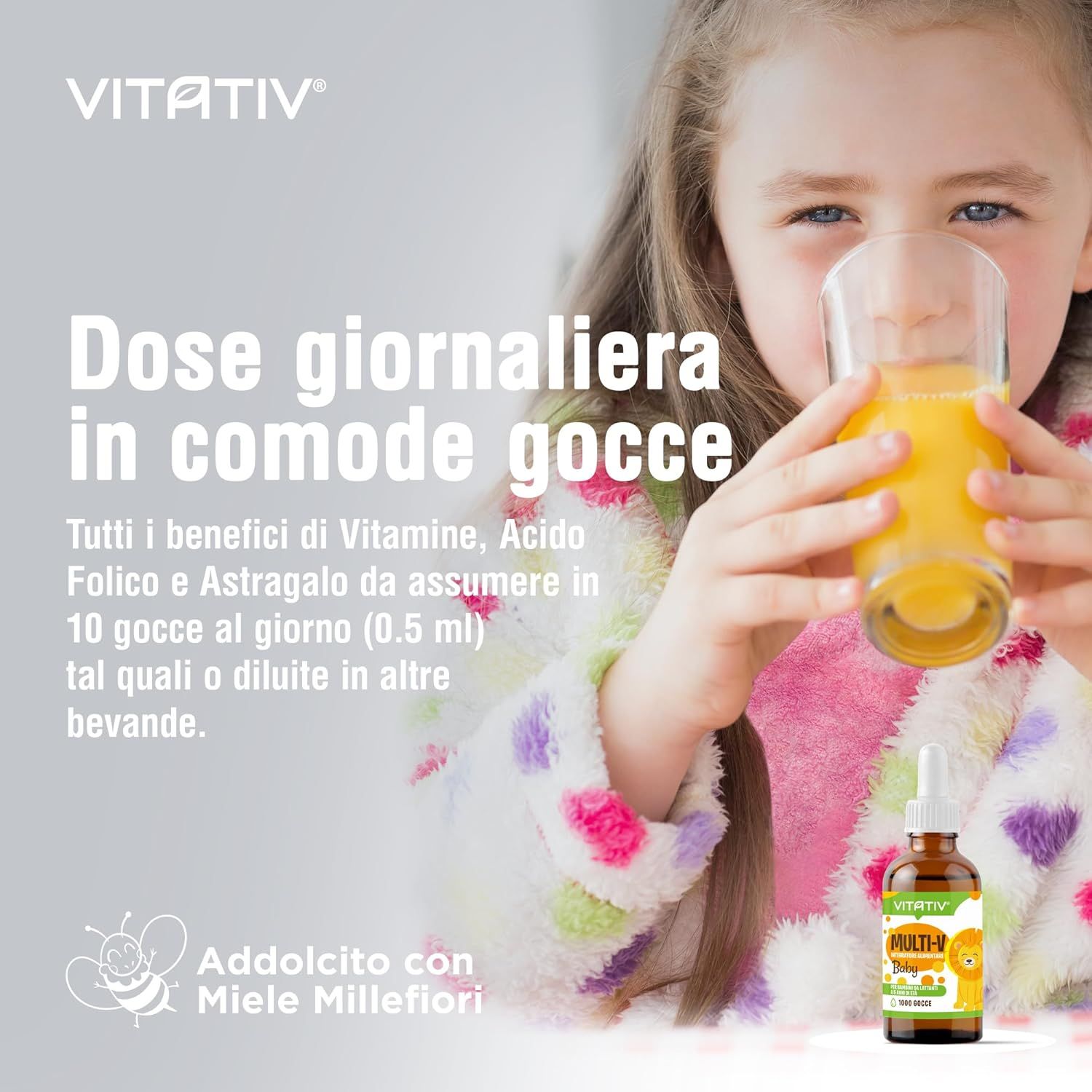 Bambina beve succo con VITATIV® MULTI-V Junior. Dosaggio: 10 gocce al giorno.