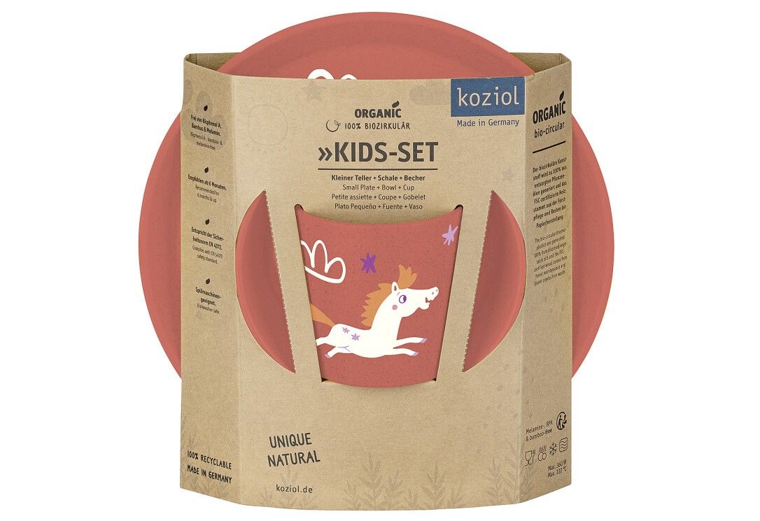 Set KOZIOL 'Dreams' per bambini confezionato. Include piatto e ciotola. Scatola con nome e logo del prodotto.