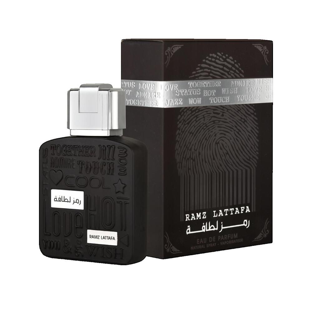 Flacone e scatola neri. Flacone con tappo argentato. Scatola con motivo impronta digitale. "RAMZ LATTAFA".