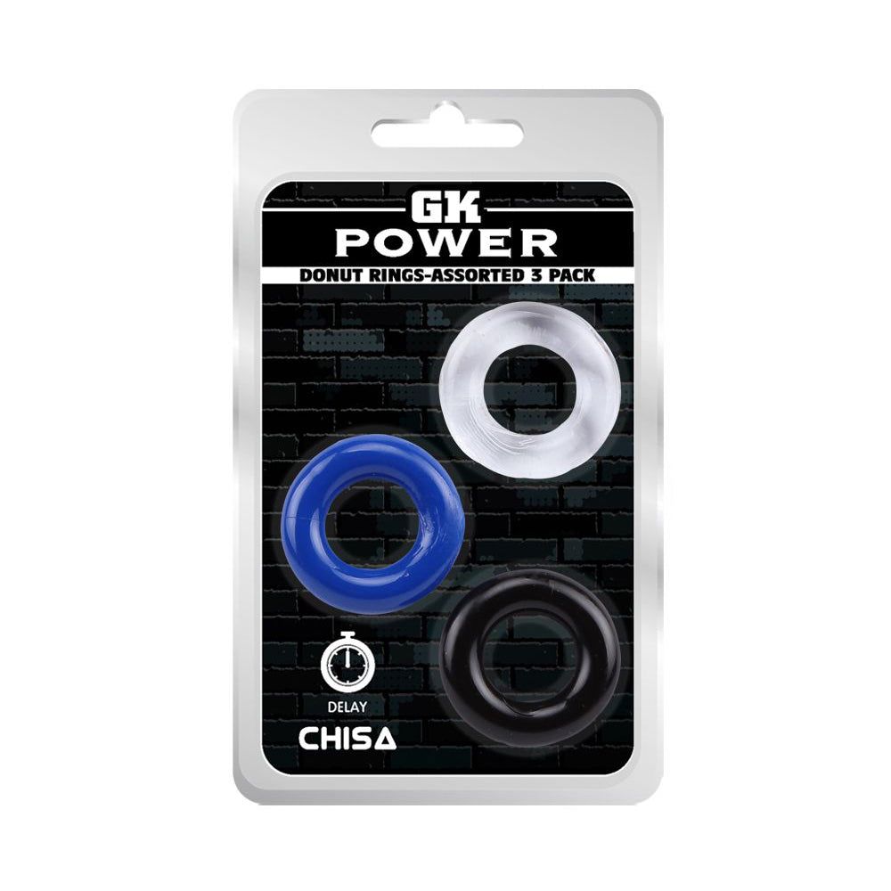 Confezione con tre anelli: blu, trasparente e nero. Testo: GK POWER, DONUT RINGS-ASSORTED 3 PACK, CHISA.