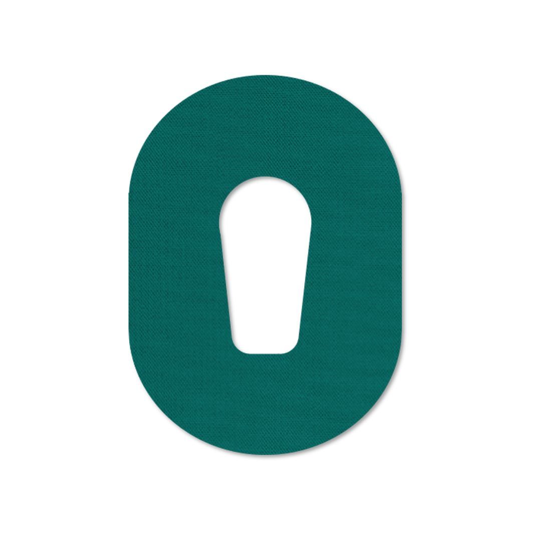 Cerotto ovale verde con intaglio. Superficie tessile.