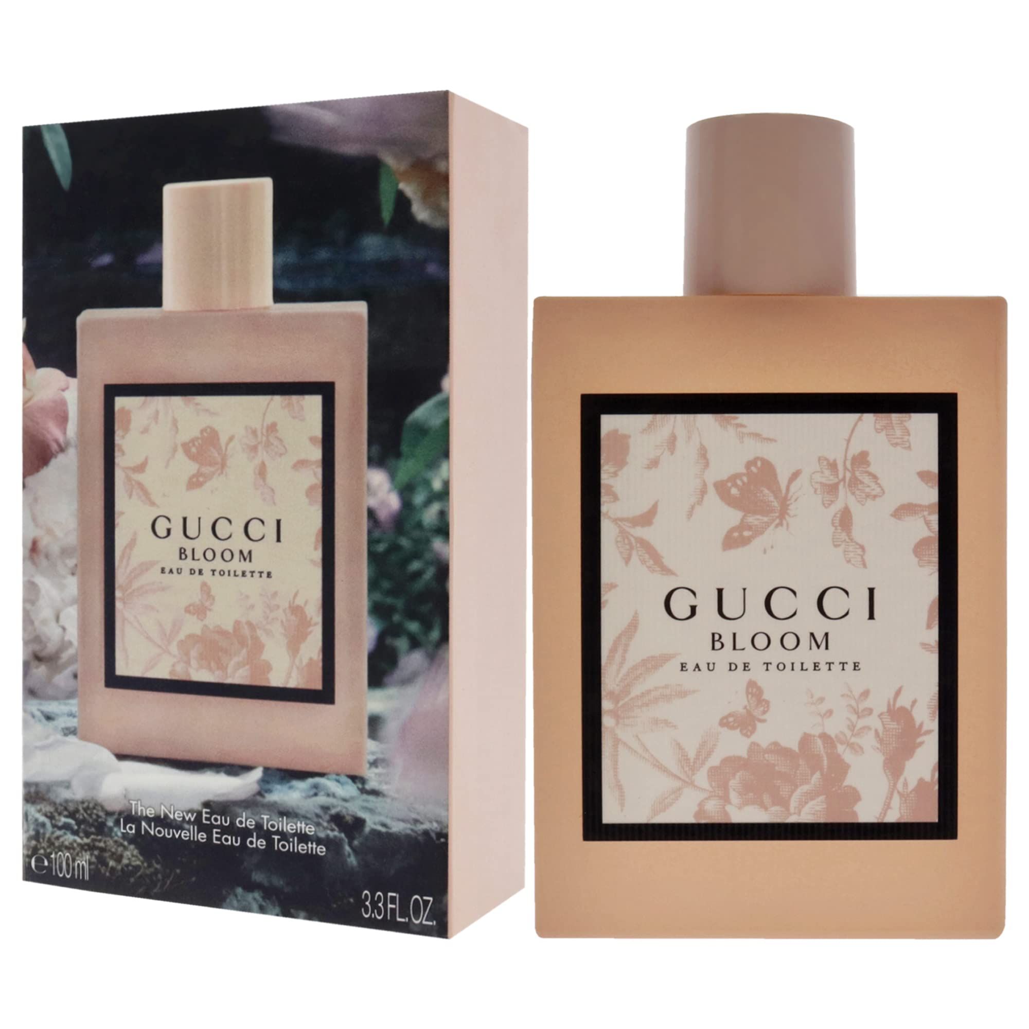 Flacone e scatola rosa. Scritta Gucci Bloom. Cornice nera con motivo floreale. Eau de Toilette.