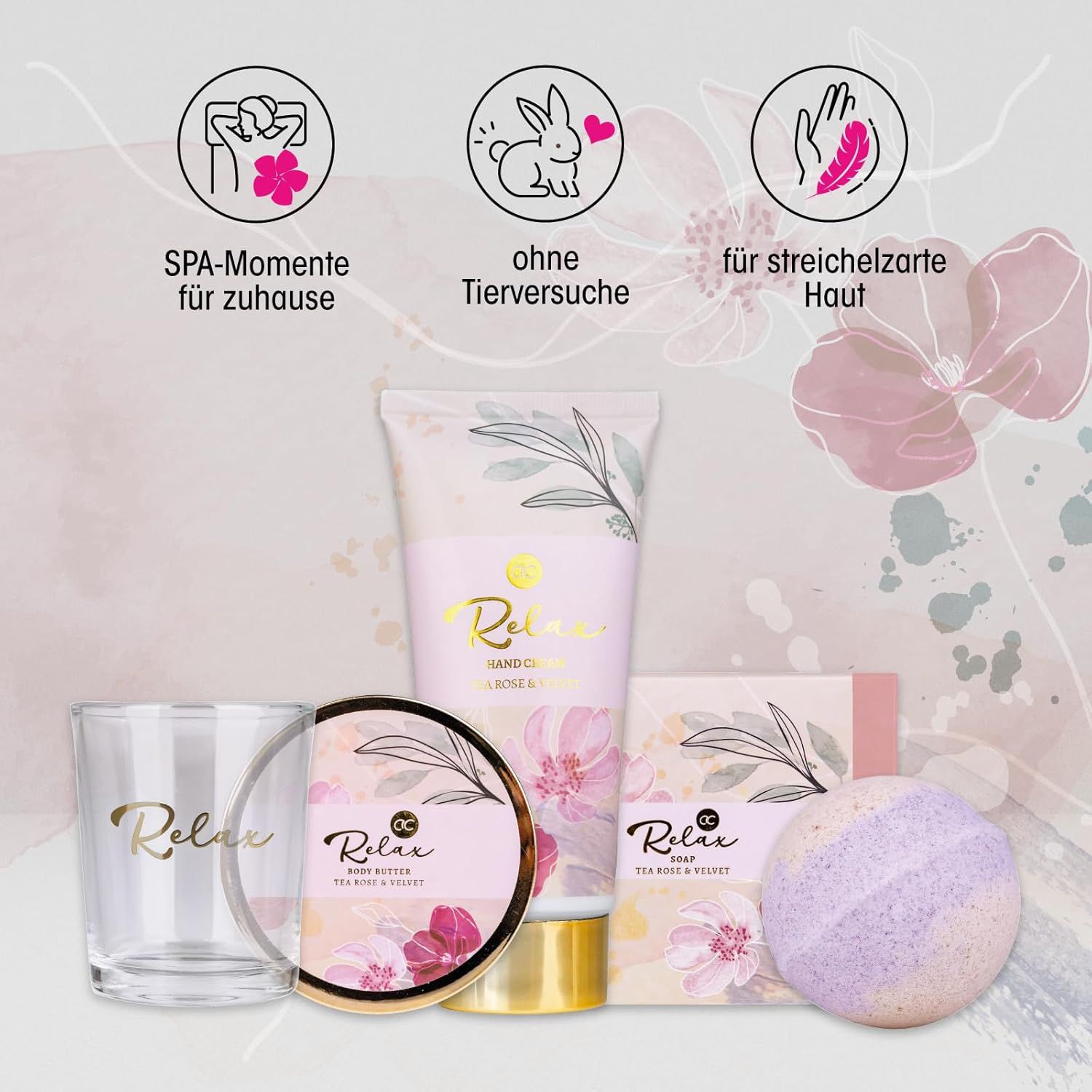 Confezione regalo con prodotti per bagno e cura della persona. Contiene crema mani, bicchiere, bomba da bagno, sapone e crema. Accenti rosa e oro.
