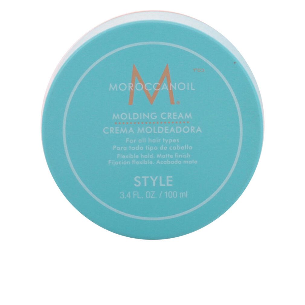 Barattolo turchese con coperchio bianco. Scritta: Moroccanoil Molding Cream. Bordo arancione. Testo: Style, 3.4 fl. oz. / 100 ml.
