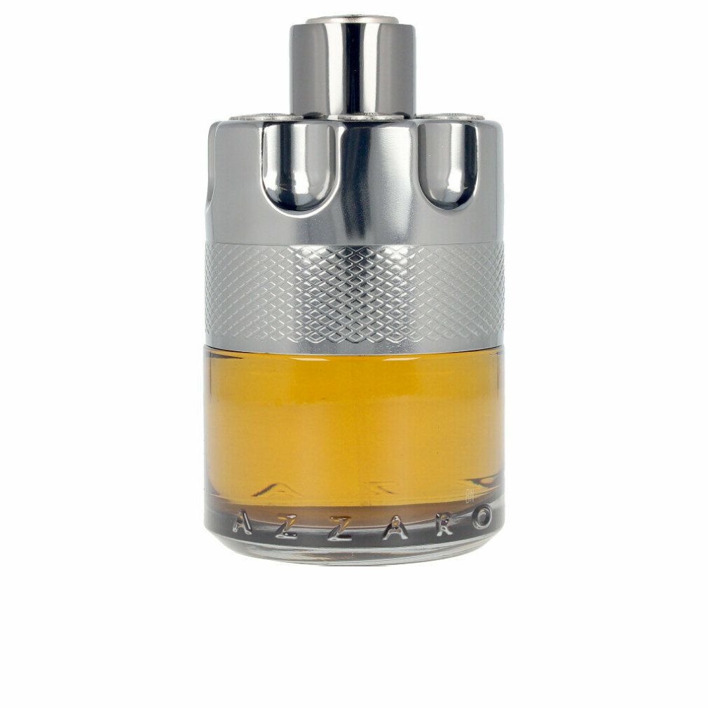 Azzaro Wanted by Night Eau de Parfum. Flacone cilindrico, tappo argentato, liquido dorato. Sfondo bianco.