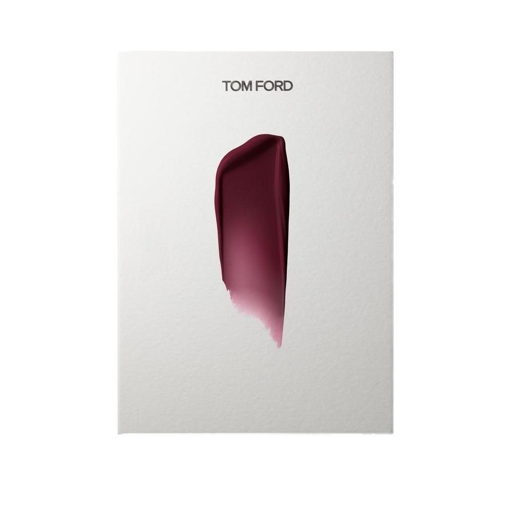 Foglio bianco con un campione di rossetto. Marchio Tom Ford in alto.