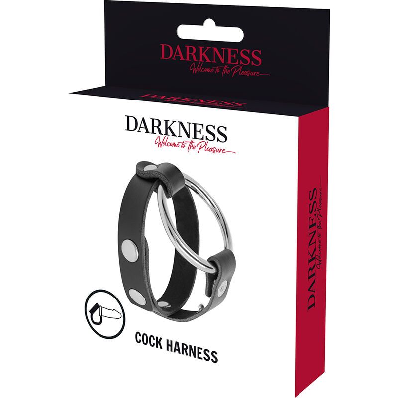 Confezione con anello per pene e scroto. Scatola nera con immagine del prodotto. Testo: DARKNESS, COCK HARNESS.