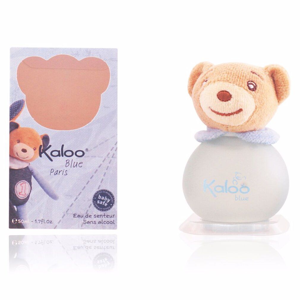 Flacone di profumo con testa di orsetto. Flacone con scritta "Kaloo Blue". Scatola con motivo orsetto e scritta "Kaloo Blue Paris".