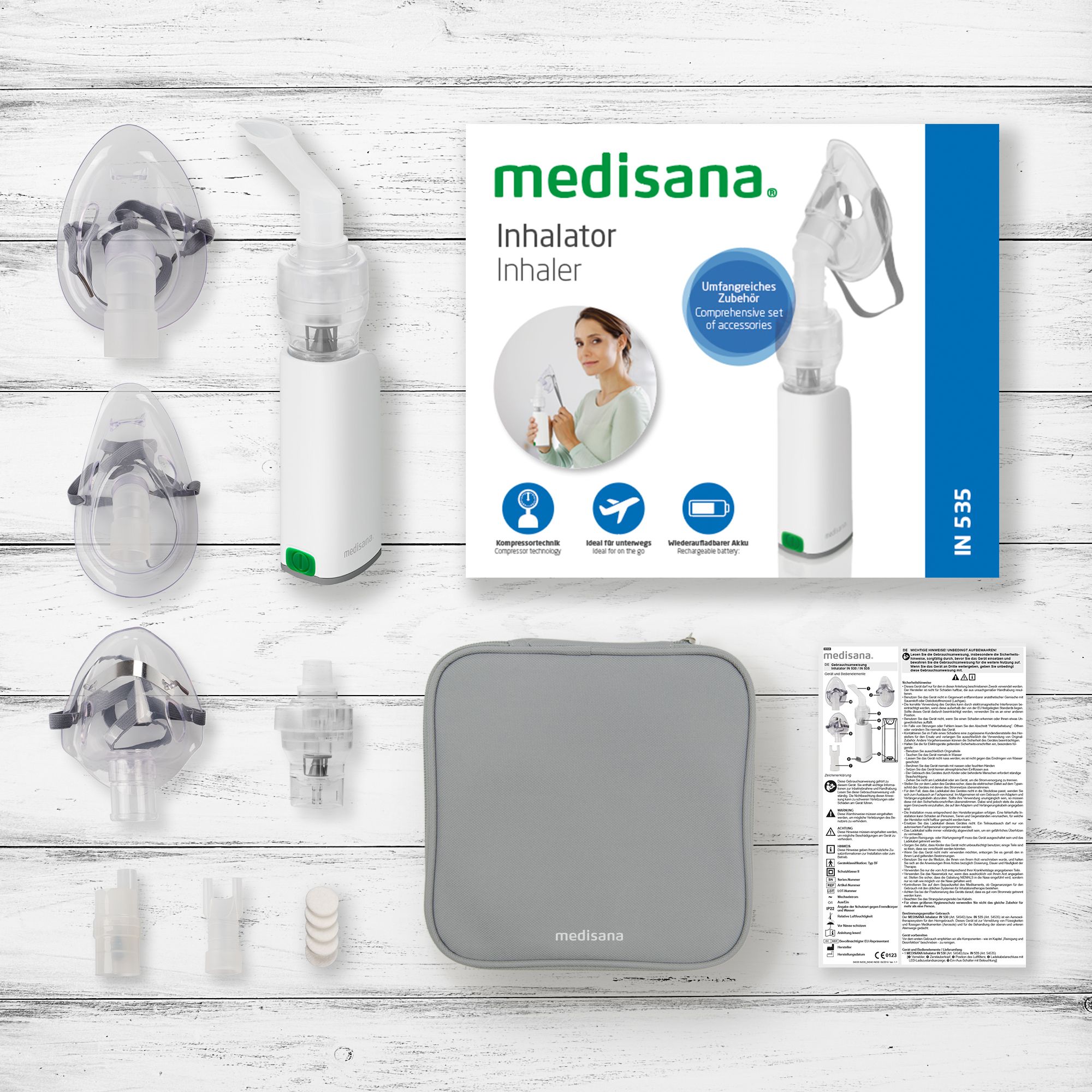 Inalatore Medisana IN 530 con accessori: maschere, boccaglio, custodia e istruzioni.