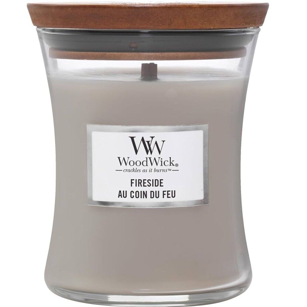 Candela a clessidra grigia con coperchio in legno. Scritta: WoodWick, Fireside. Contenitore di vetro.