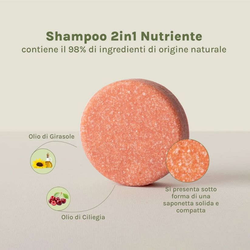 Shampoo solido rotondo. Con illustrazioni di olio di girasole e ciliegia. Testo: Shampoo 2in1 Nutriente.