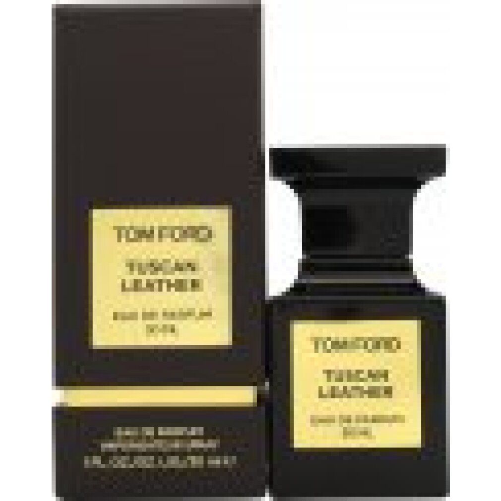 Flacone nero accanto a una scatola nera. Etichetta dorata con scritta: TOM FORD TUSCAN LEATHER. 50 ml.