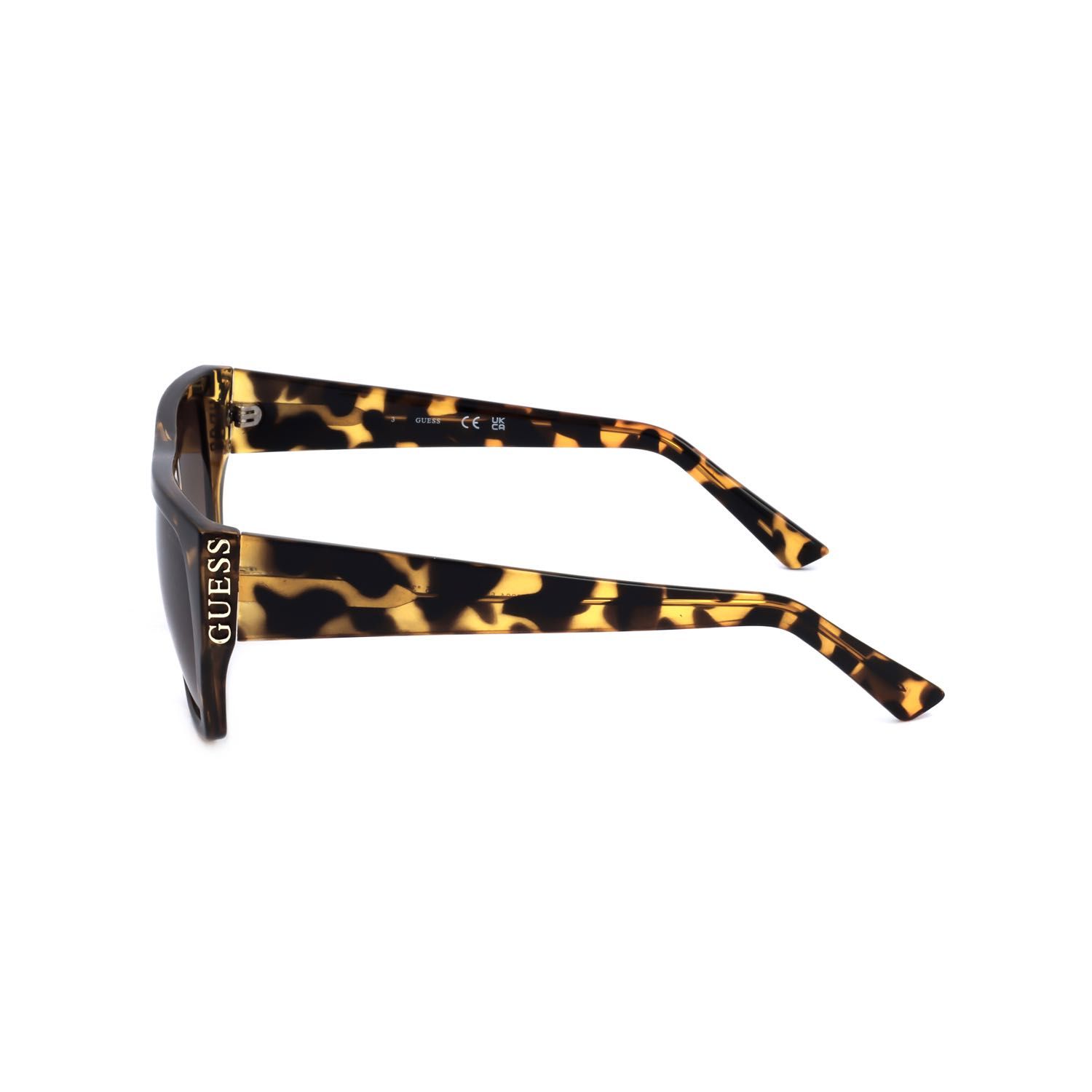 Occhiali da sole tartarugati marroni con logo Guess argentato sulla stanghetta.