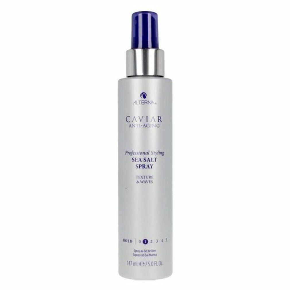 Spray per lo styling con erogatore blu e collo argentato. Nome prodotto: Caviar Anti-Aging Sea Salt Spray. Texture & Waves.